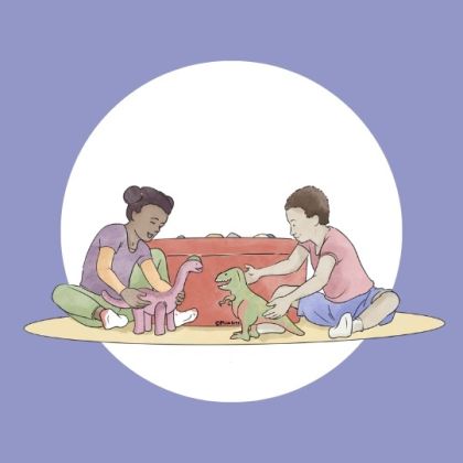 An image of two children playing with toy dinosaurs.